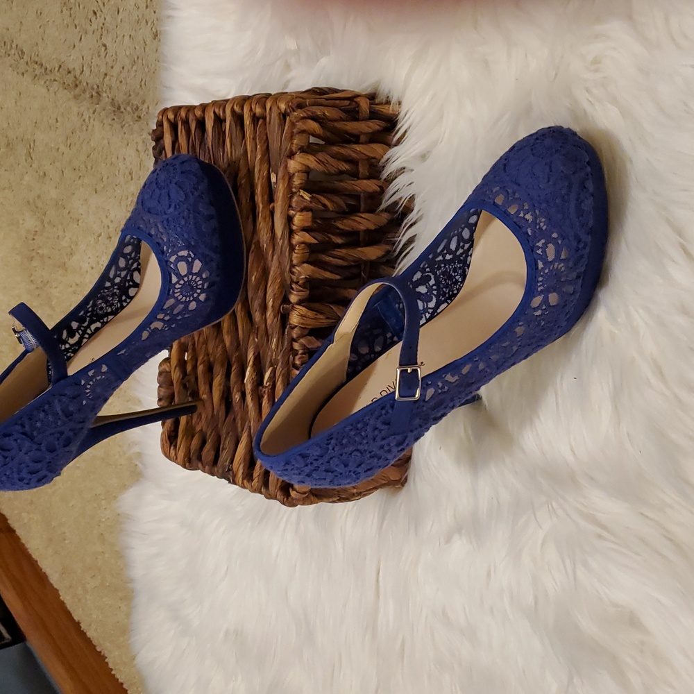 Wild Diva lace platform pumps.